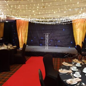 venue theming with gold drapes, starcloth & fairy lights